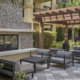 Outdoor lounge with fireplace at Dwell Maitland apartments